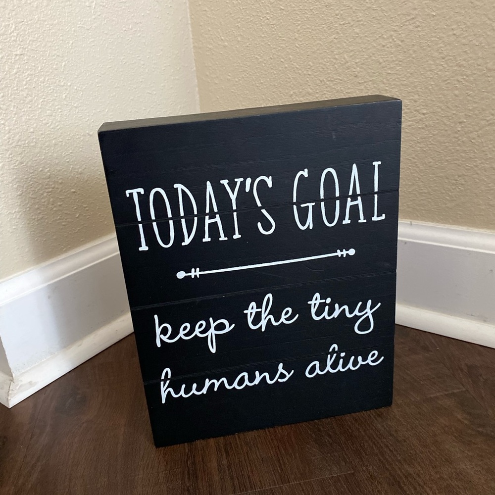 “Todays Goal, keep the tiny humans alive” black and white sign